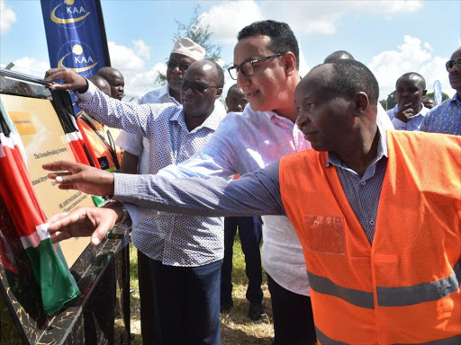 Cabinet secretaries James Macharia and Najib Balala and project director Johnson Matu launch the groundbreaking for the rehabilitation of Mombasa International Airport Airside Pavements and Airfield Ground Lighting System Project on Tuesday, November 20, 2018. /ANDREW KASUKU