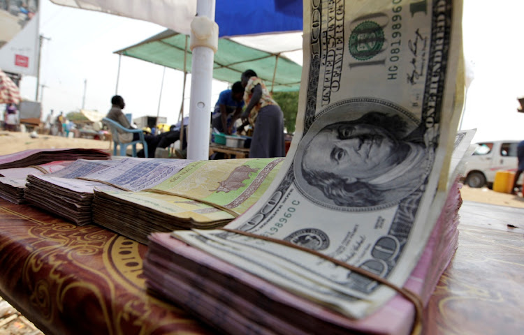 Banknotes displayed on a roadside currency exchange stall along a street in Juba, South Sudan. The country is seeking loans as its dollar reserve dwindles.