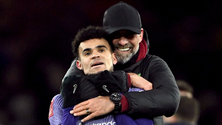 Liverpool manager Juergen Klopp celebrates with Luis Diaz after the match against Arsenal.