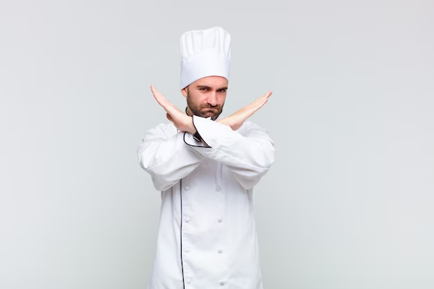 Chef gesturing with crossed hands in front