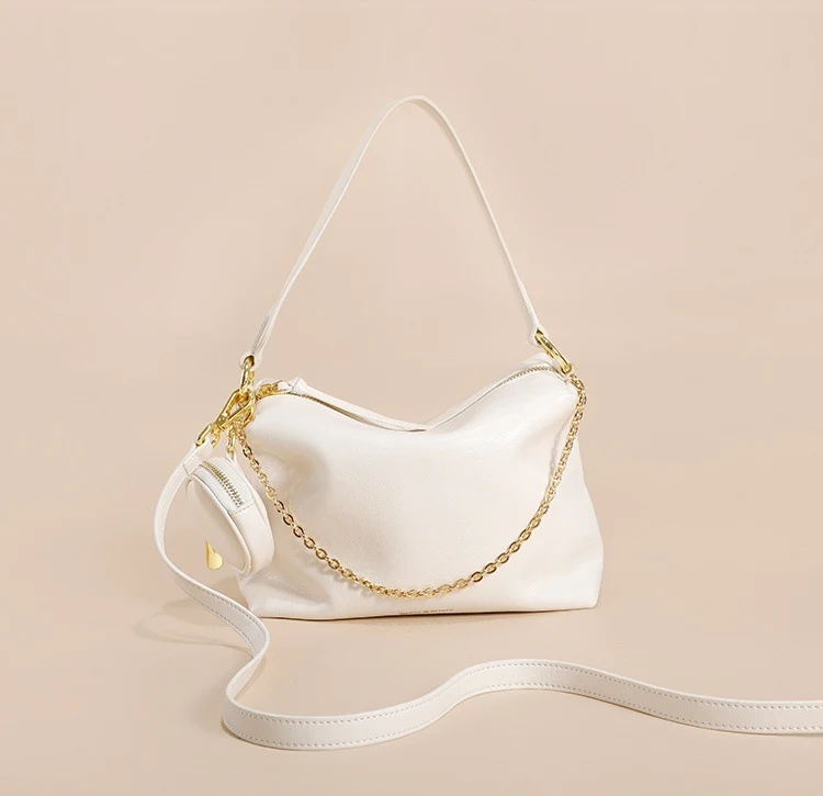 Bolsa feminina transversal de couro genuíno premium, design especial e requintado em couro de vaca. Sofisticação e elegância para você.
