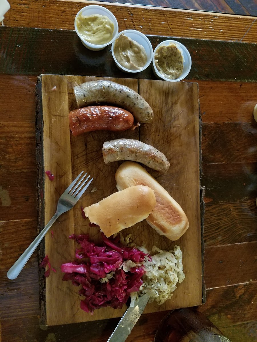 Sausage board with a gluten free bun substituted for the pretzel rolls.