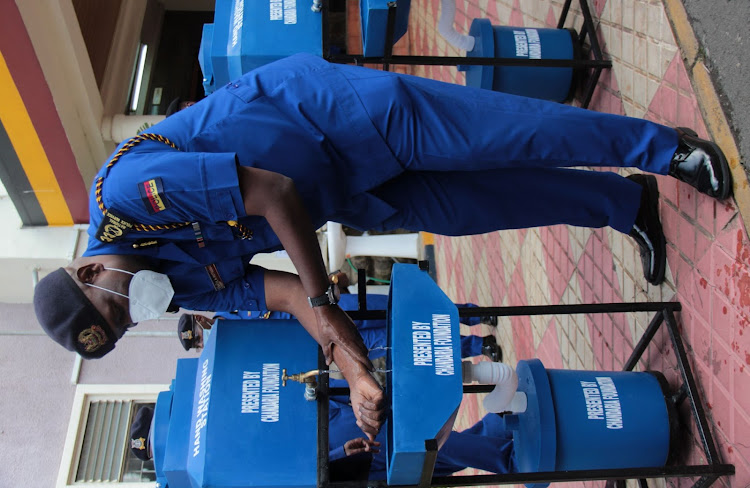 Mutyambai washes his hands using the donated containers