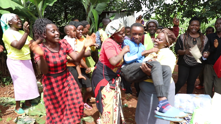 Kawira village residents celebrate with David Muhia after he got a sponsorship from Gukena FM Presenter MC Kajim. He will join Weithaga boys high school.