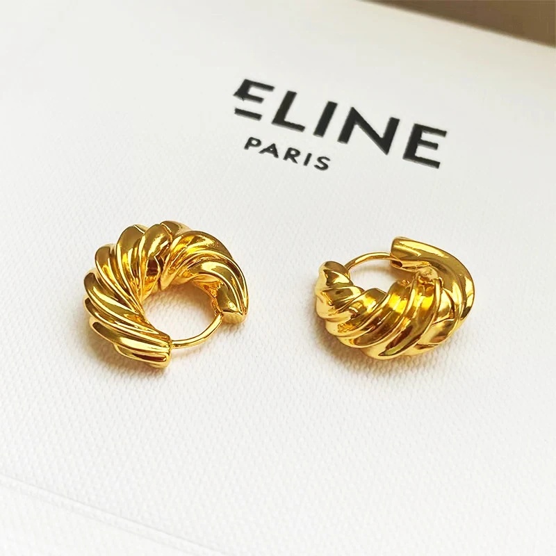 Boucles d'oreilles cornes torsadées géométriques en laiton métallique pour femmes, un accessoire élégant pour sublimer votre look.