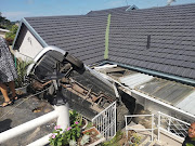 A 68-year-old woman suffered injuries after crashing her car into her Verulam home on Tuesday.