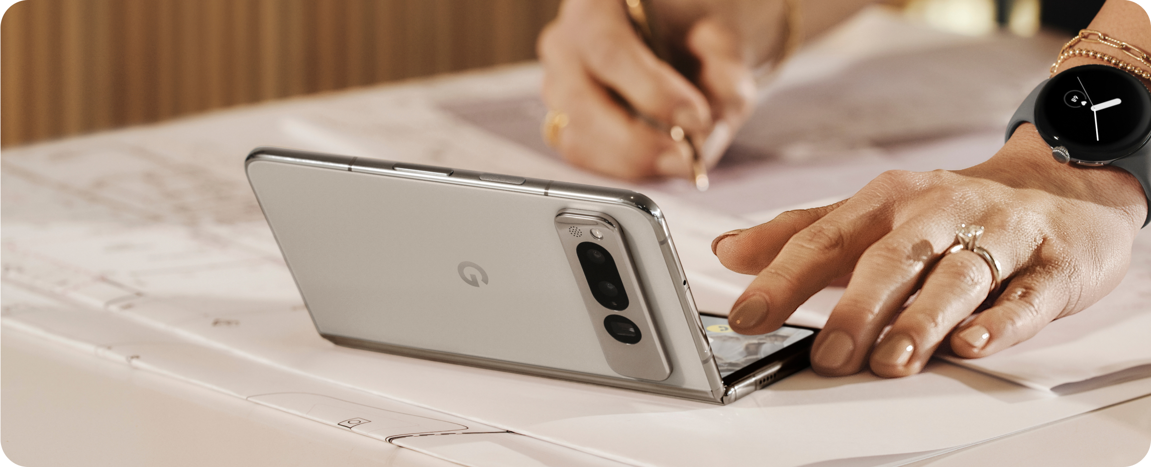 A woman working on her Google Pixel Fold.