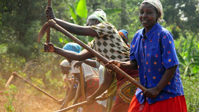 Women tilling land.