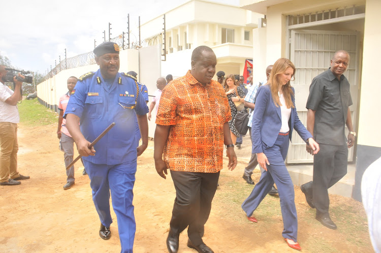 Inspector General of Police Hillary Mutyambai, Interior CS Fred Matiang'i, UK High Commissioner to Kenya Jane Marriott and deputy DCI Hamisi Masa after they commissioned the Anti-Terror Police Unit at the Coast regional police headquarters in Mombasa.