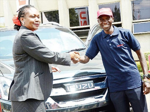 Isuzu EA managing director Rita Kavashe with marathoner Eliud Kipchoge at a past event/FILE