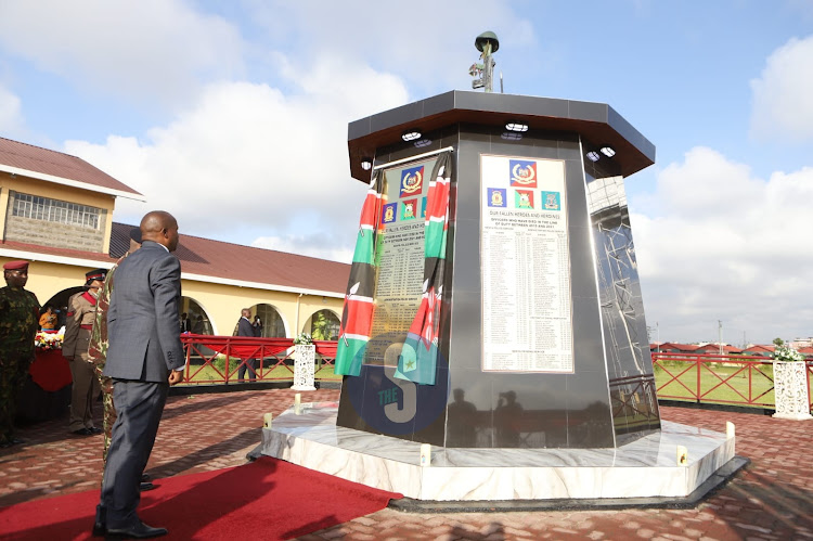 Interior CS Kithure Kindiki unveils a monument with names of fallen police officers at Embakasi AP training College, Nairobi on Friday, December 16, 2022.