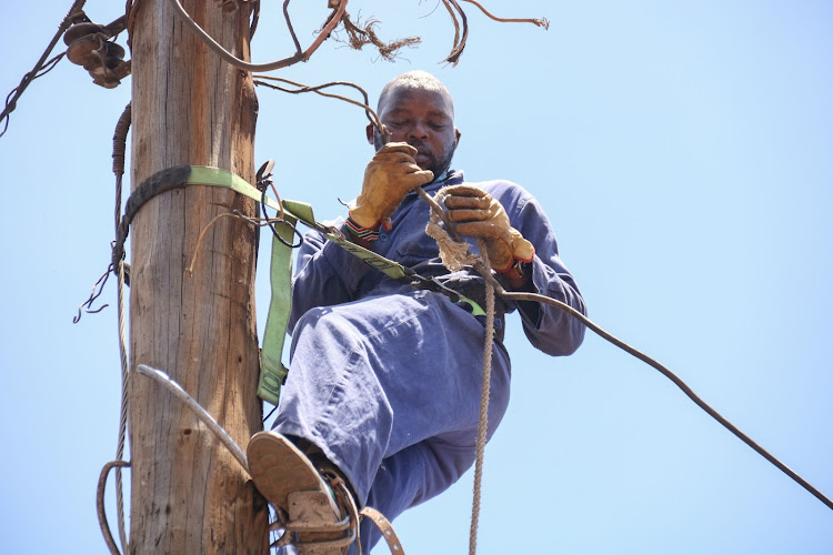 KPLC technical staff disconnect illegal electricity connection at Huruma Estate Nairobi on 15 March during the operation of countrywide inspection by the KPLC to curb illegal electricity connections and enhance efficiency in distribution