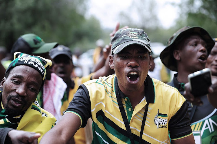 ANC supporters demonstrate outside the venue on the opening day of the 55th national conference of the ANC at Nasrec in Johannesburg on Friday. Picture: BLOOMBERG