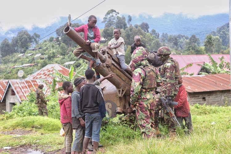 KDF officers interact with children as they play