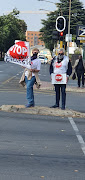 Silent protesters in action, calling for better safety measures to protect cyclists.
