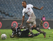 Vuyo Mere of Swallows FC challenges Gabadinho Mhango of Orlando Pirates  Sydney. 