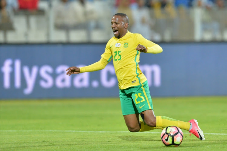 Bafana Bafana winger Aubrey Ngoma falls under the challenge during South Africa's international friendly match against Zambia at Moruleng Stadium on June 13, 2017 Moruleng, South Africa.