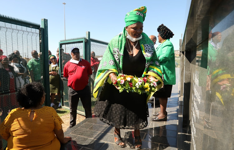 IN REMEMBRANCE: Nombulelo Mini, who lost her brother Thobekile Mahuwa at the Langa massacre in 1985, lays a wreath at a remembrance ceremony on Saturday