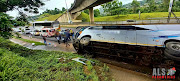 The driver lost control and the bus crashed into the barrier before coming to a rest on its side. 