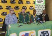 CEO of ASA Richard Stander, Luvo’s coach Neil Cornelius, World champion Luvo Manyonga and media manager Sifiso Cele during the arrival of Luvo Manyonga, IAAF World Championship Long Jump Gold Medal winner at OR Tambo International Airport on August 26, 2017 in Johannesburg, South Africa. 