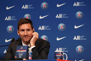 Lionel Messi speaks to the press at the Parc des Princes in Paris, after signing for Paris St Germain.