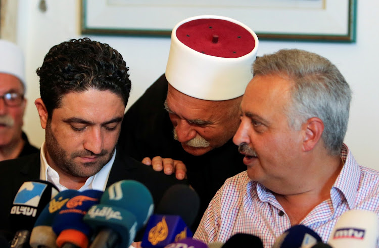 Saleh al-Gharib, the state minister for refugee affairs, whose two bodyguards were killed yesterday in what he termed an attempted assassination, sits with Talal Arslan, a Druze politician, during a news conference, in Khaldeh, near Beirut, Lebanon July 1, 2019. Picture: REUTERS / AZIZ TAHER