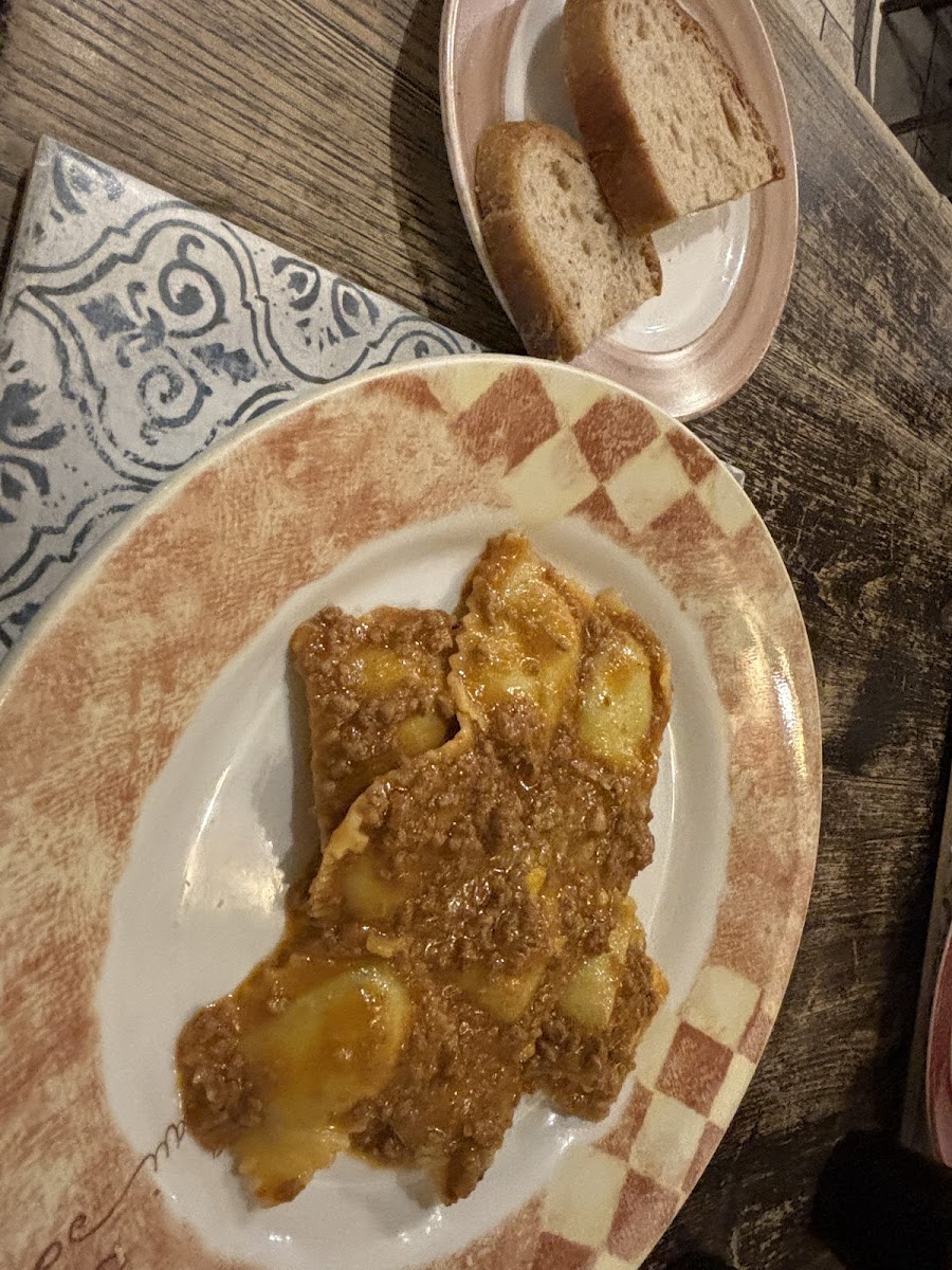 Ravioli with meat sauce butter and cheese, plus gf bread