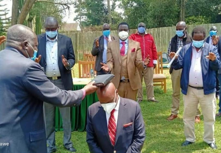 Pastors and political leaders praying for Baringo Senator Gideon Moi at Kenmosa in Eldoret.on July 26.