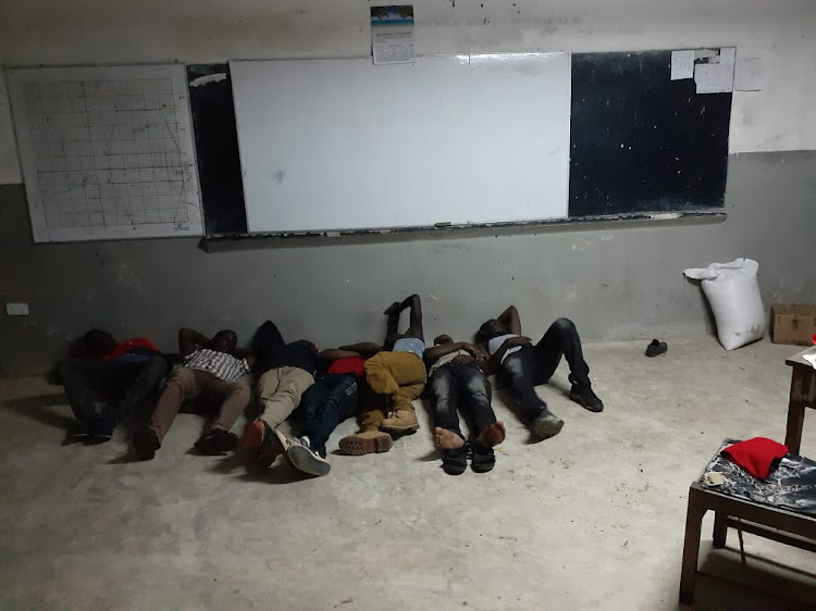 The seven returnees in a classroom at Mokowe Secondary School on Monday evening.