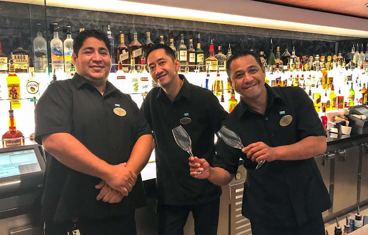 Bartenders at midnight at the Spinnaker's Lounge disco on Norwegian Jade. 