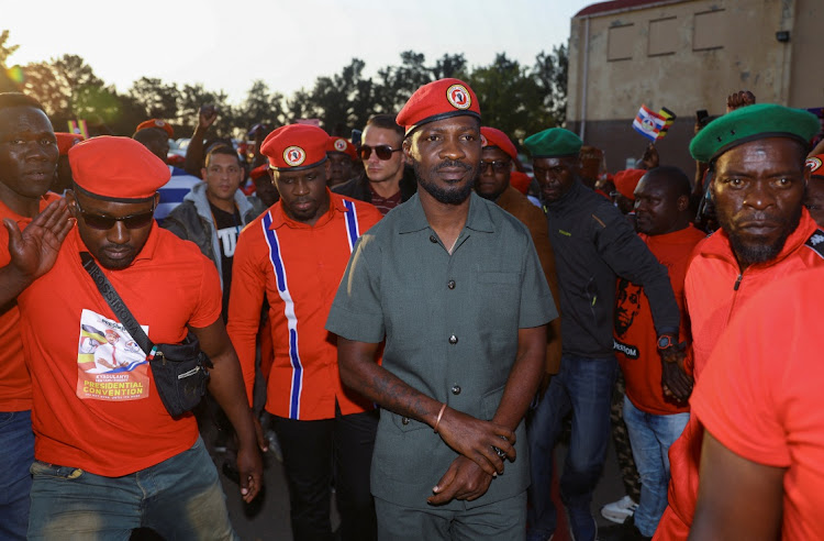 Ugandan opposition leader and singer Robert Kyagulanyi Ssentamu, known as Bobi Wine, arrives to address Ugandans living in South Africa on political issues in their home country at the sports ground in Germiston on October 3 2023.