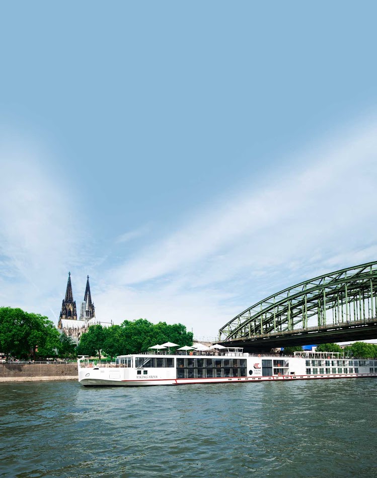 Viking Freya cruises the Rhine past Cologne and under the Hohenzollern Bridge.