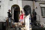 Peter and Natasha Scannell, left, and Mike Nzima in Lorentzville, Johannesburg.