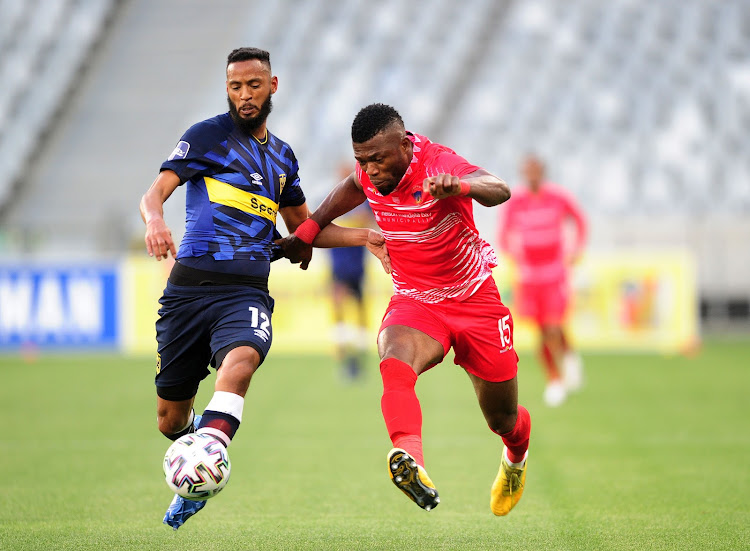 Augustine Kwem, right, of Chippa United, and Cape Town City’s Taariq Fielies chase possession in their DStv Premiership soccer game in Cape Town on Saturday