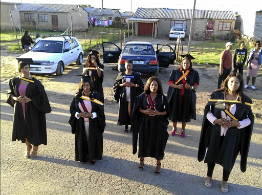 Puleng Serame wears her blue sash, along with six other graduates from Thabong in Welkom. Their photos have inspired many.