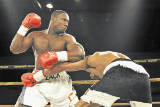 FEARSOME: Zack Mwekassa punishes Kizito Ruhamya during their catchweight clash at Emperor's Palace recently. Photo: Duif du Toit/Gallo Images