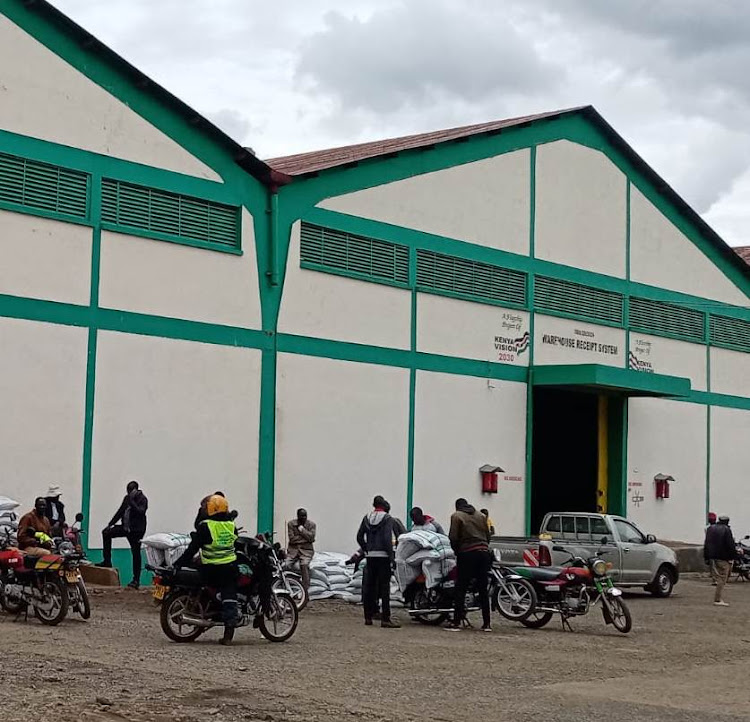 Small-scale farmers collect subsidised fertiliser at the NCPB stores in Eldoret