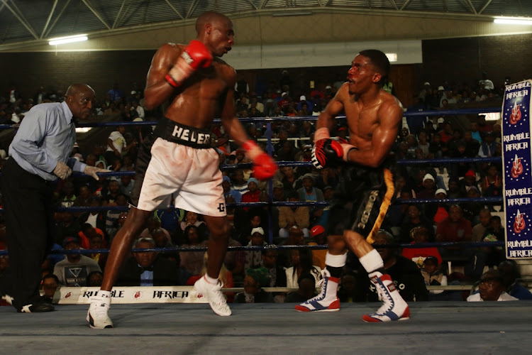 Toto Helebe and Cebo Ngema during their SA title bout at Orient Theatre in East London.