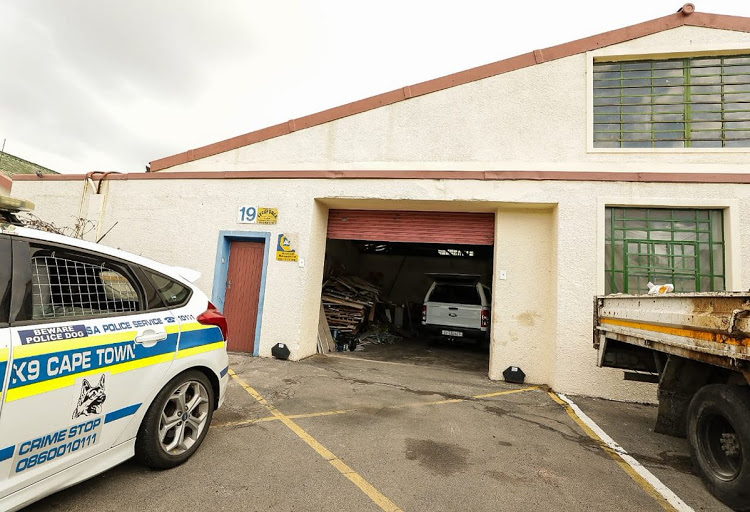 Police in front of a warehouse believed to be an illegal abalone processing facility on Bellville South.