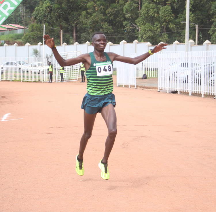 Daniel Simiyu crosses the finish at the Safaricom Kisii 10km road race