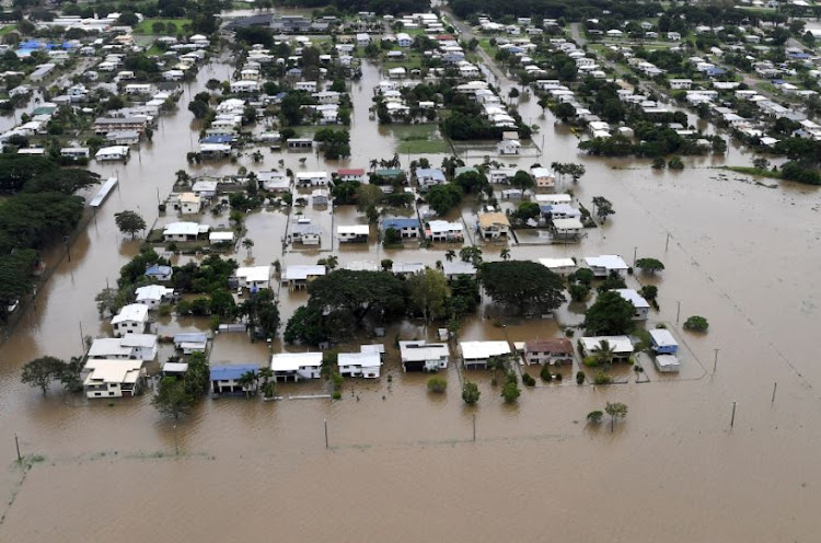 Houses can be seen surrounded by flood waters in the town of Ingham, located in North Queensland, Australia, March 11, 2018.