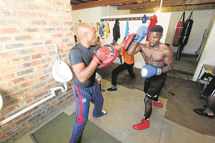 Mziwoxolo ‘Black Tiger’ Ndwayana is put through his paces by co-coach Thabang Hlalele.