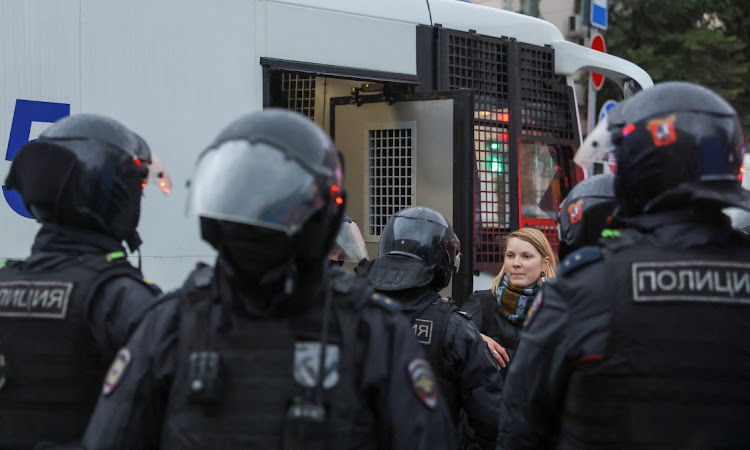 Russian law enforcement officers surround a protester during a rally against the mobilisation of reservists ordered by President Vladimir Putin, in Moscow, Russia, September 24 2022. Picture: REUTERS