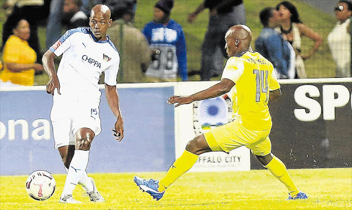 GAME ON: Chippa United’s Ruben Cloete, left, competes with Sipho Mngomezulu of Jomo Cosmos during the match at Buffalo City Stadium in East London on Saturday eveningPicture: STEPHANIE LLOYD