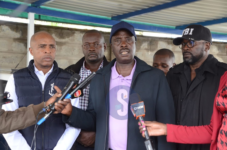 Lawyer Danstan Omari together with other lawyers representing SBL director Josiah Kariuki addressing journalists outside Nairobi Area Police Station on April 6, 2024.