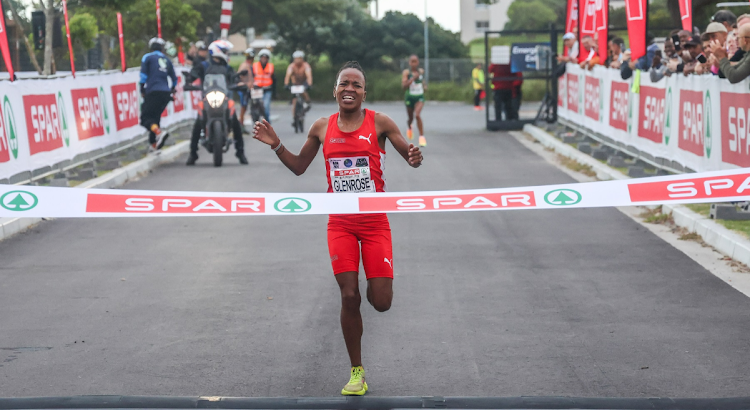 Glenrose Xaba crosses the finishing line during the SPAR Women's Challenge race in Cape Town.