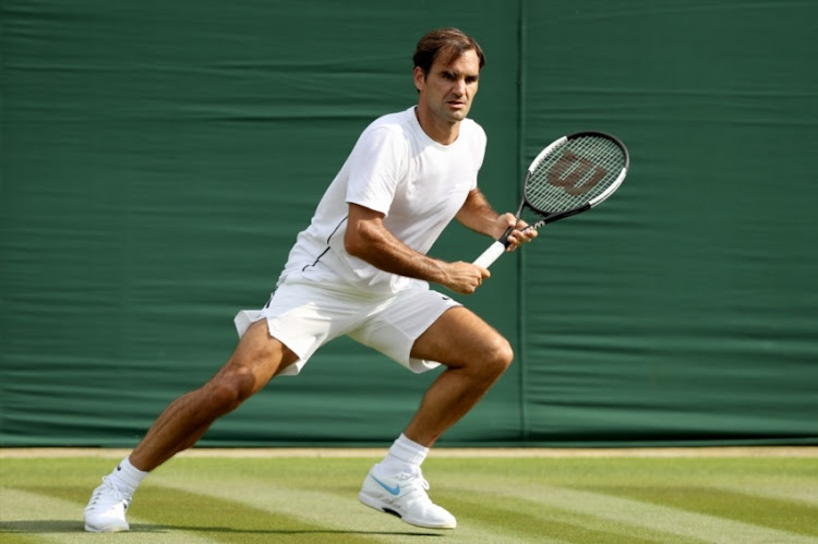 Roger Federer of Switzerland practices on court during training for the Wimbledon Lawn Tennis Championships at the All England Lawn Tennis and Croquet Club at Wimbledon on June 28, 2018 in London, England.