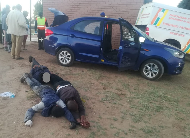 A hijacked driver was found in the boot of his car early on Tuesday after being driven around by four gunmen.