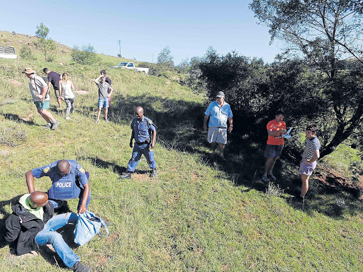 DRONE VISUAL: A man being arrested by the police dog unit during Sunday’s farm attack and community chase near Stutterheim, captured by farmer Greg Miles using his radio-controlled drone-borne camera Picture: SUPPLIED