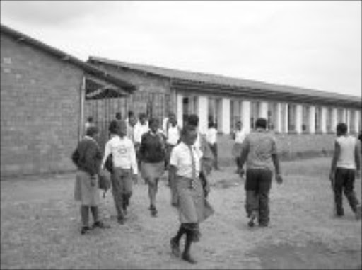 SHOCK: Pupils at Mabelebele High in Umlazi were terrified after a former pupil went on a shooting spree at the school after he stole his policeman father's service pistol. He is now fighting for his life in a Durban hospital under police guard after shooting himself when cops surrounded him. © Sowetan.